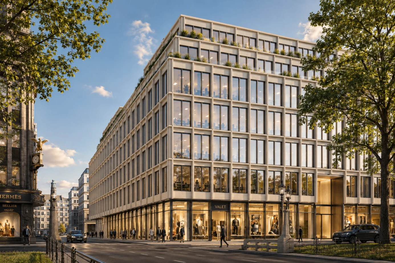 Büro- und Geschäftshaus in Düsseldorf mit heller Rasterfassade und großen Schaufensterflächen im Erdgeschoss
